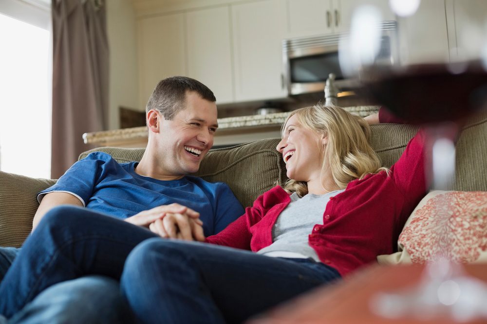 happy couple on sofa