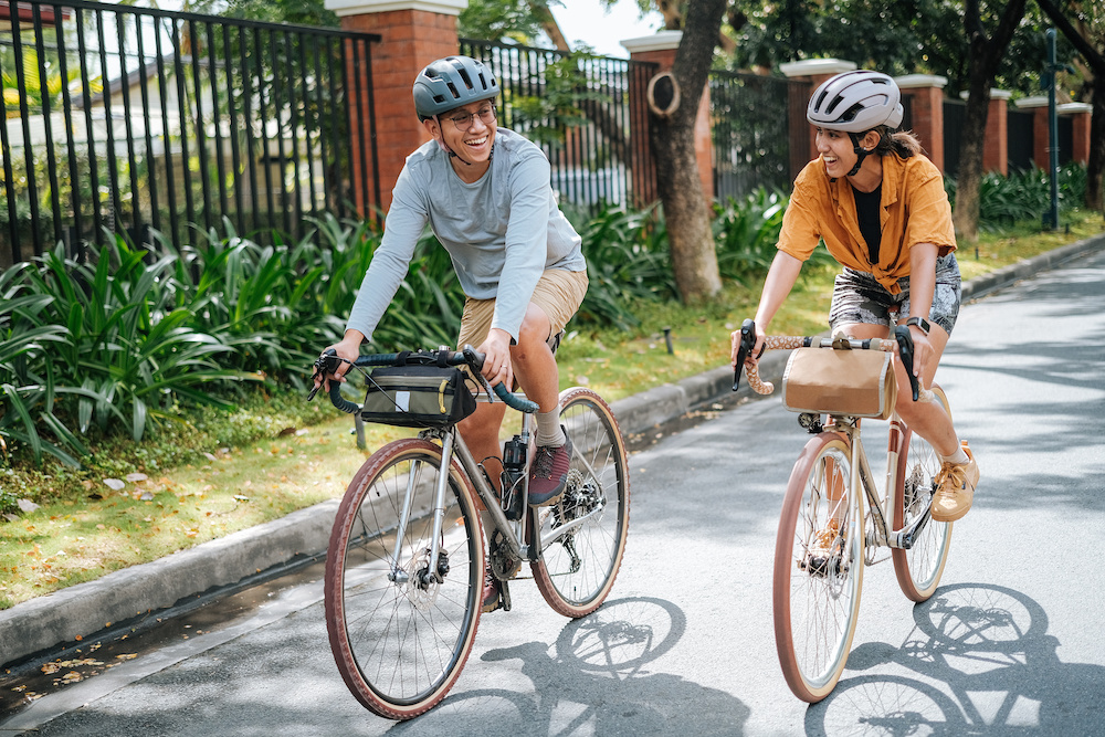 happy couple on bikes